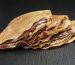 thin crepes or blinis with chocolate cream on dark slate board