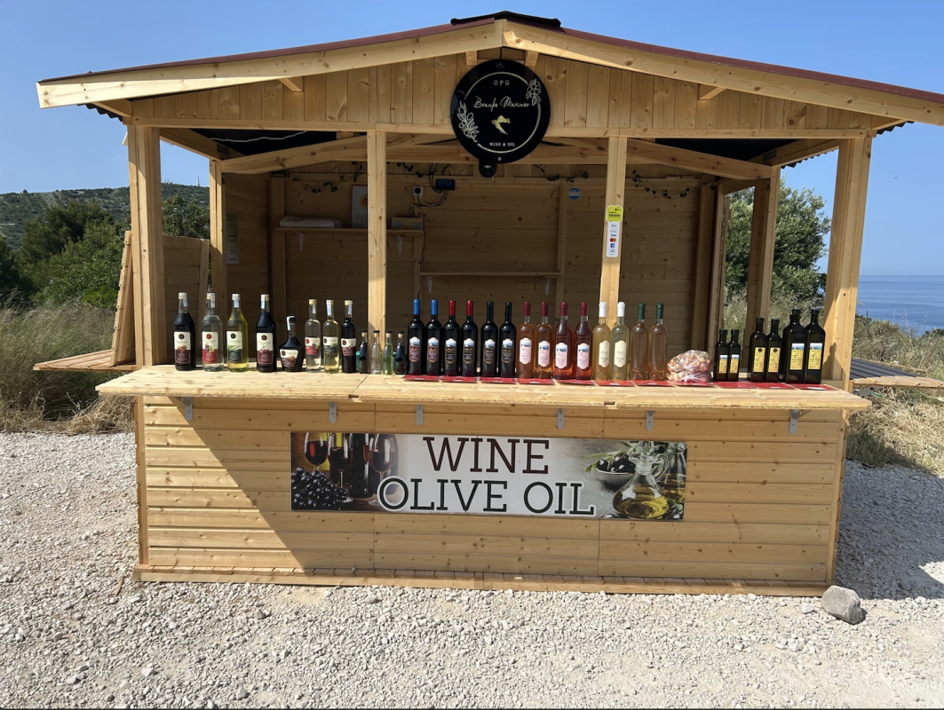 Adriatic Coastal Road above Primošten with a family-run stand offering olive oil, wine, and rakija